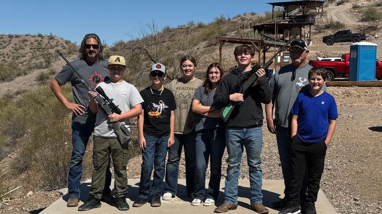 Youth hunters and mentors at shooting range