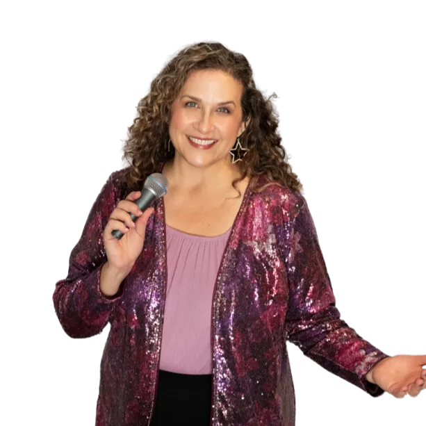 Tracie Root holding microphone speaking with bold brilliance