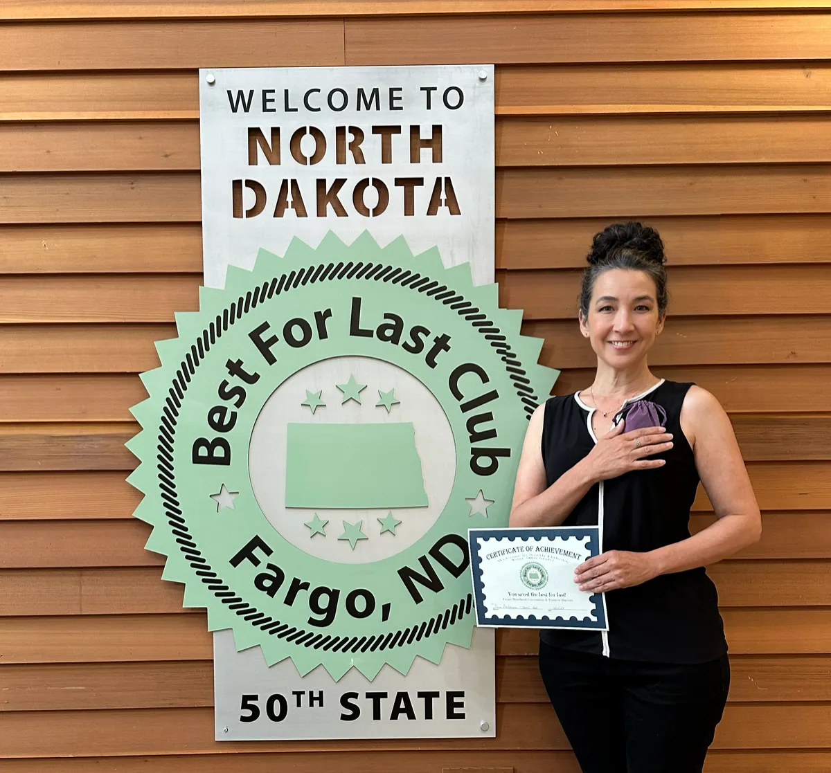 Theresa Ritchie at the North Dakota Best for Last Club, completing her father Jerry Hutcheson's journey to all 50 states