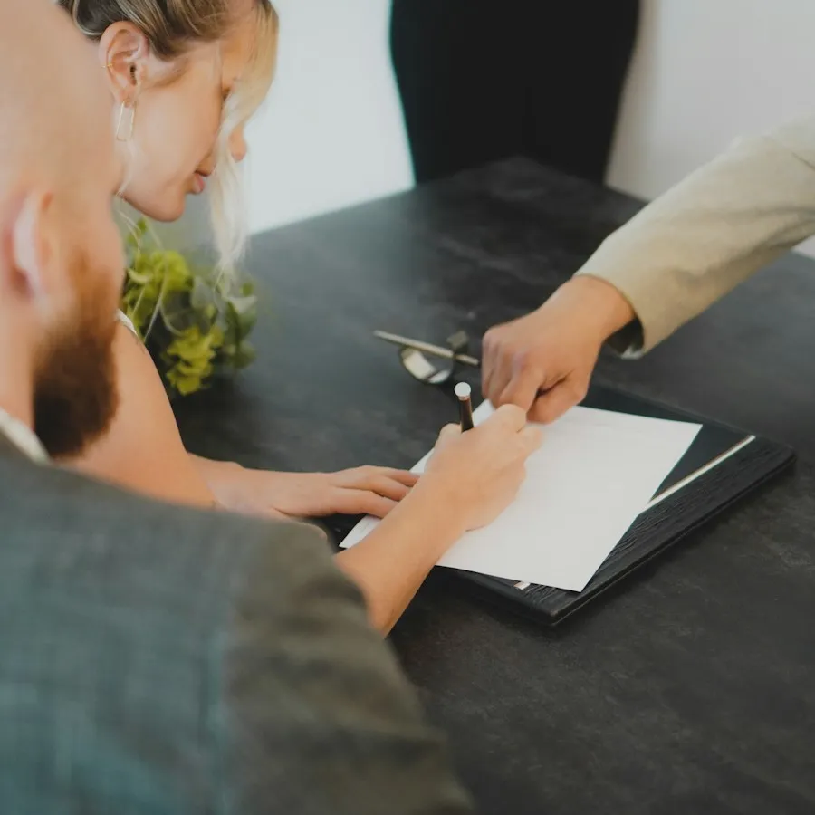 Business owner signing financing paperwork