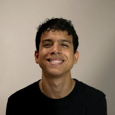 A smiling man in a black shirt, business owner in Sterling, VA