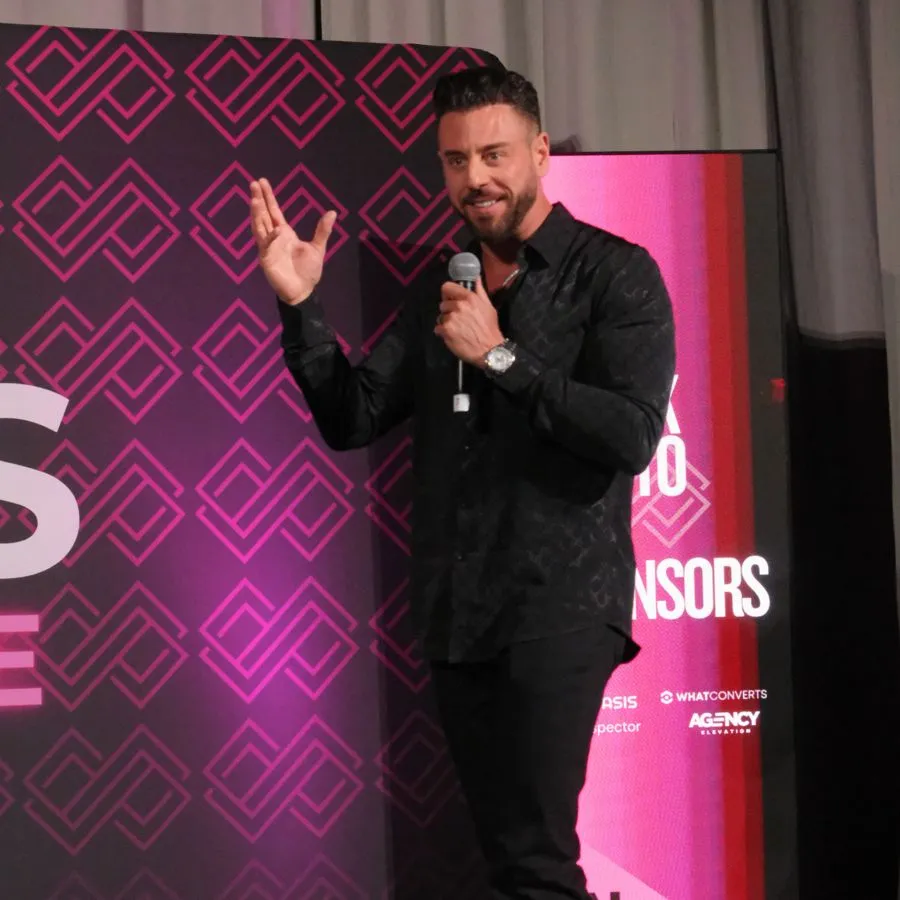 Morgan (Founder) speaking on stage