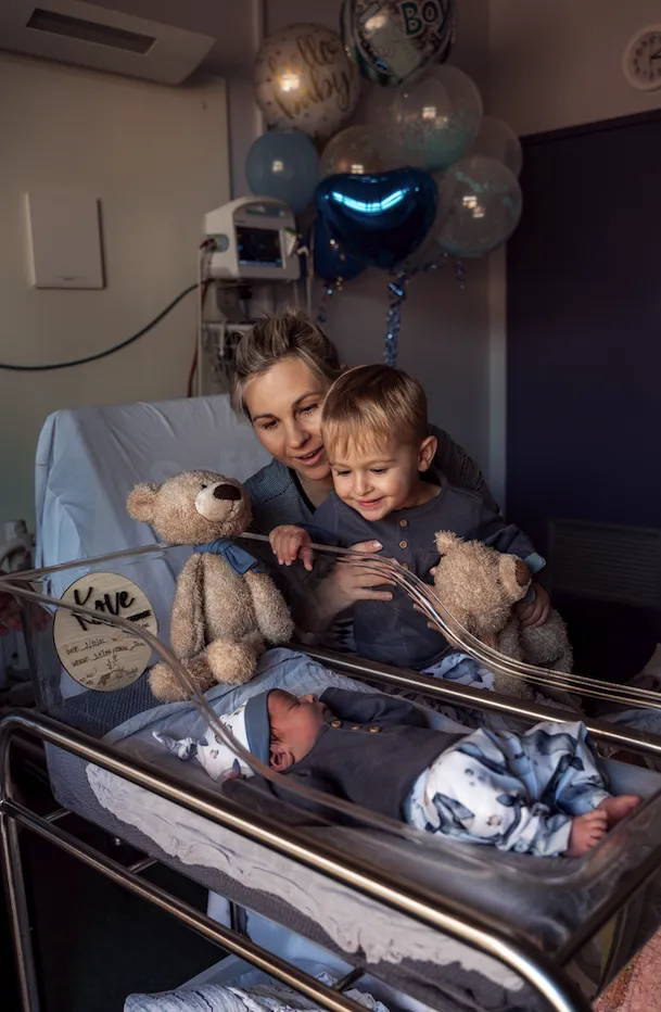 Bek Pozzoli in hospital with her toddler and newborn baby