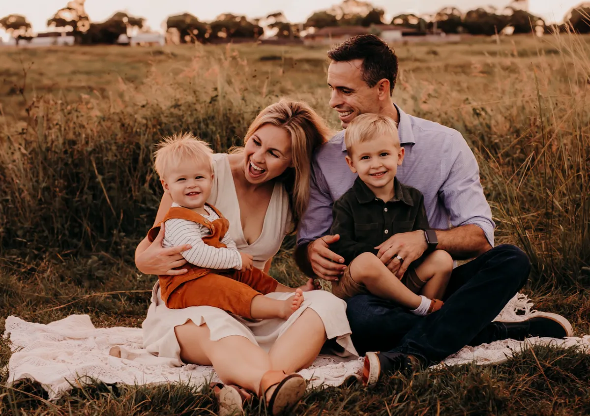 Bek Pozzoli's family relaxing together outdoors