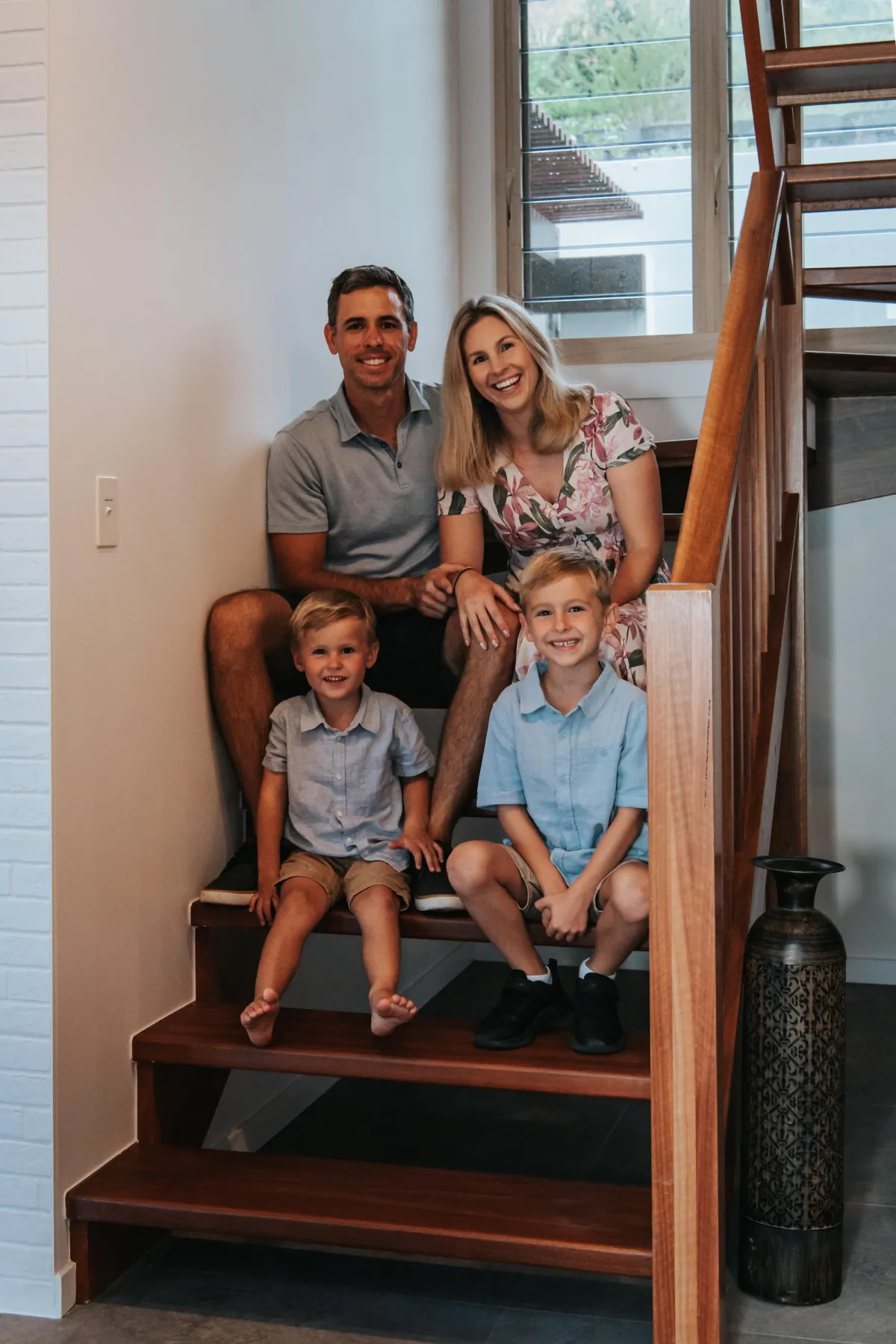 Bek Pozzoli with her husband and two sons at home