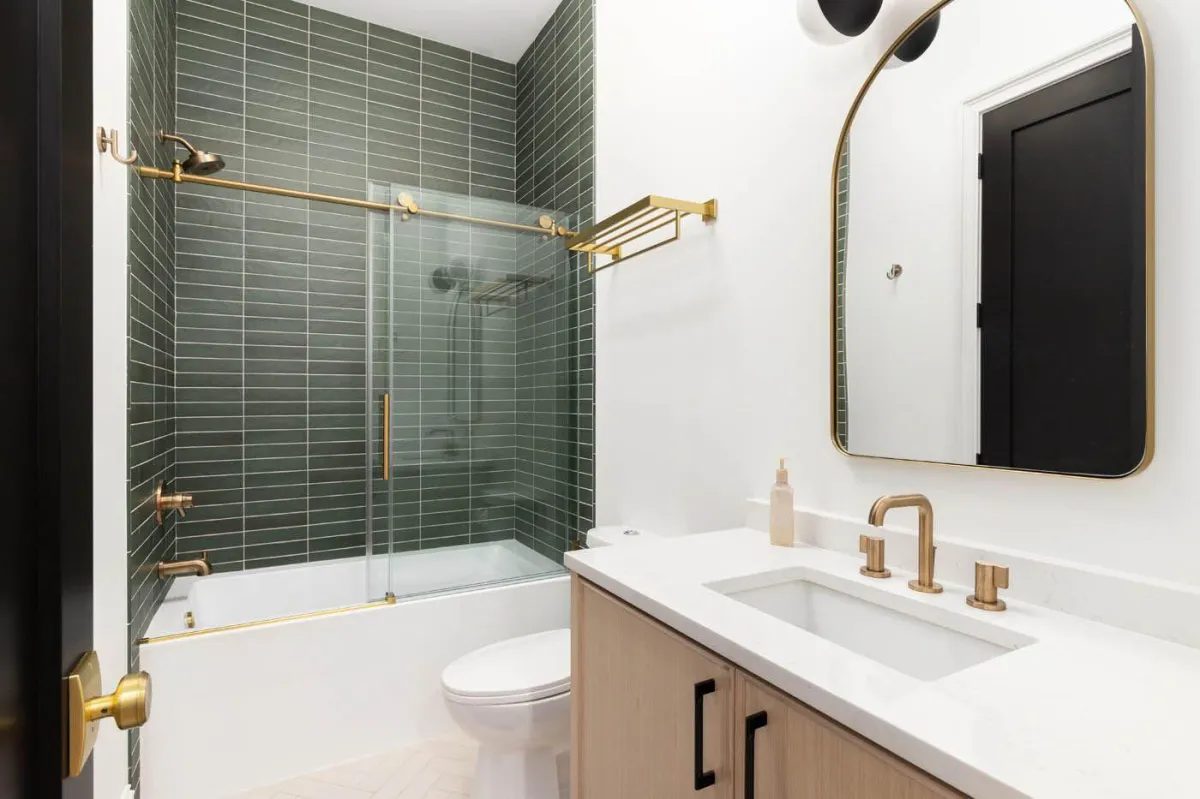 A picture showcasing a floor and shower remodel in Lawrenceville, GA from Footprints Bath and Tile.