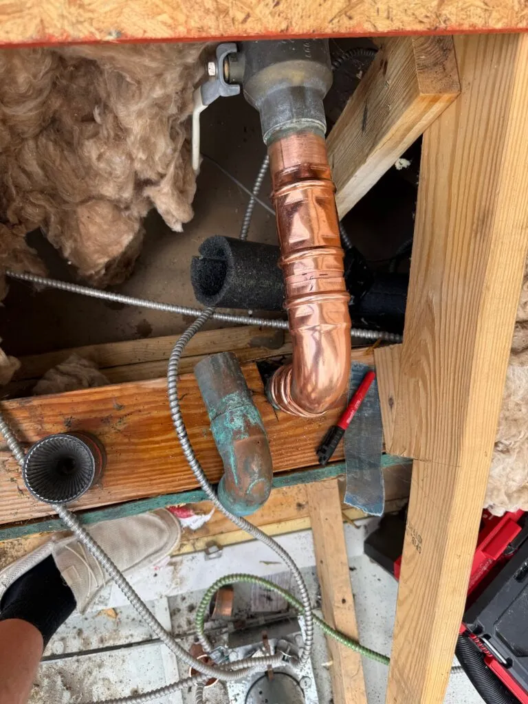 Interior plumbing inspection under a kitchen sink