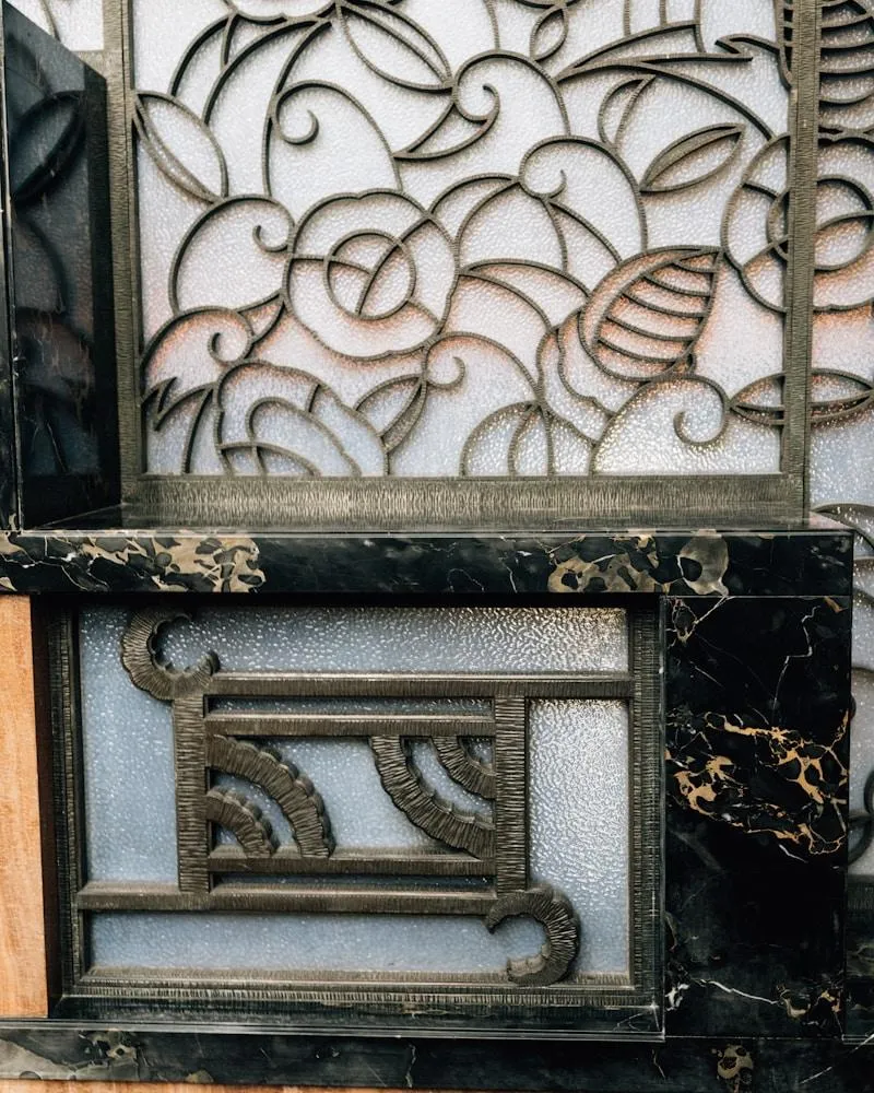 Ornate metal scrollwork on frosted glass panels