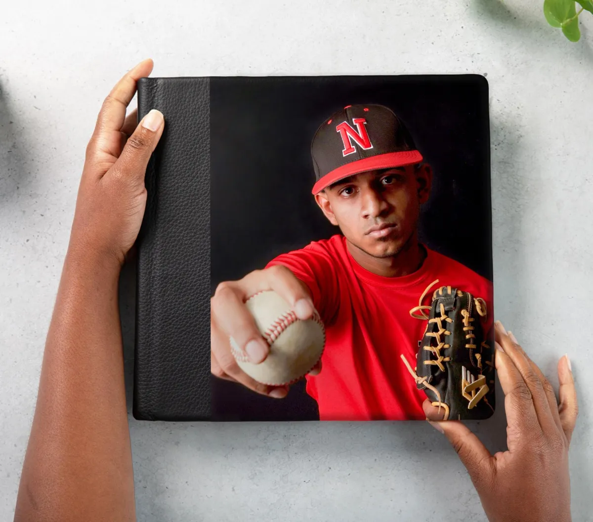 Hands holding photo album