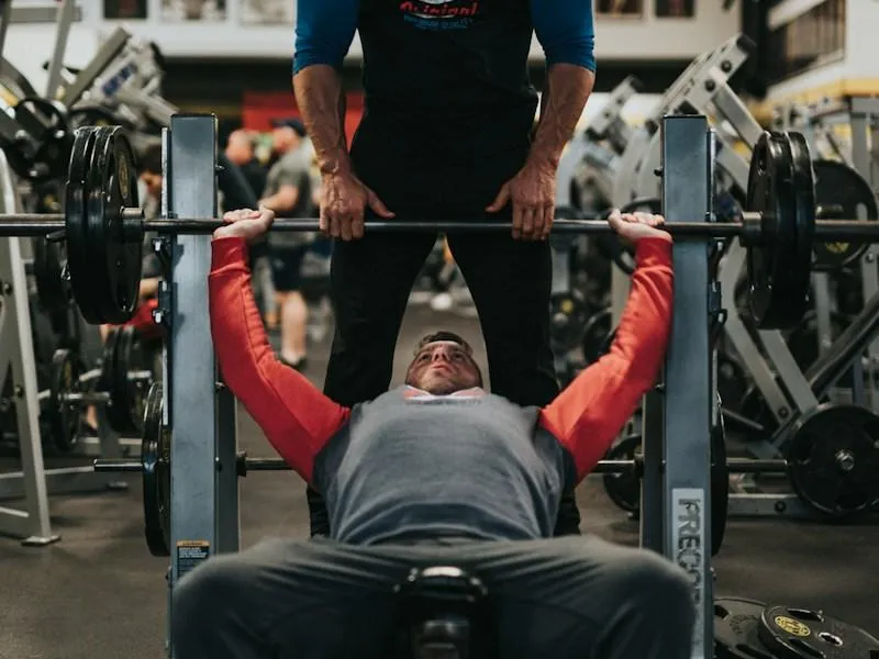 Man reviewing his progress on a bench after a coaching session