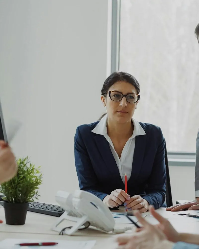 Business professionals collaborating in a modern office meeting