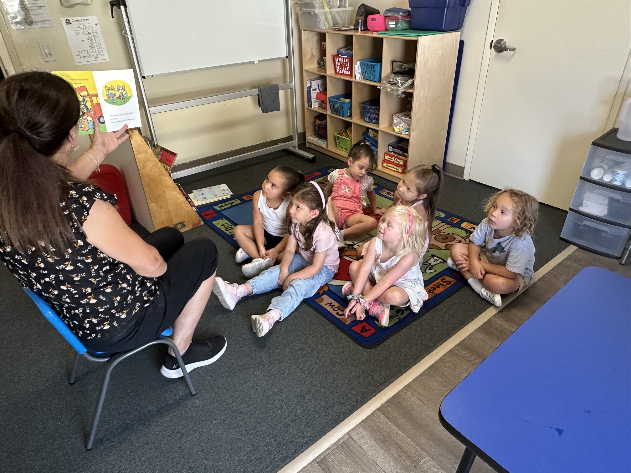 Toddlers and teacher in a classroom
