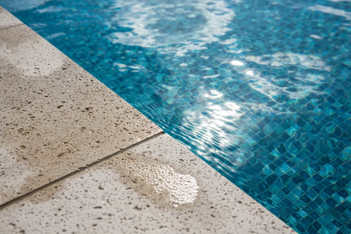 Sparkling pool water and tile edge close-up for a premium feel