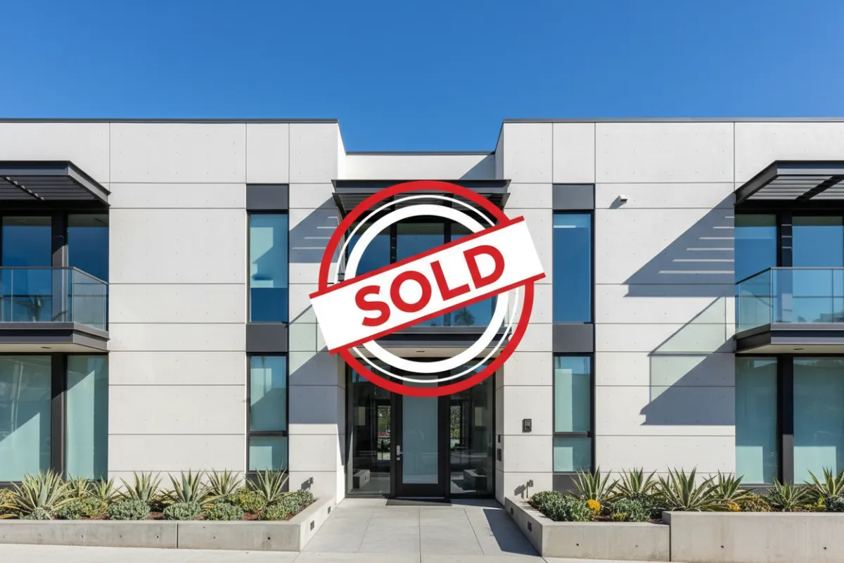 Contemporary condo exterior with Sold badge overlay
