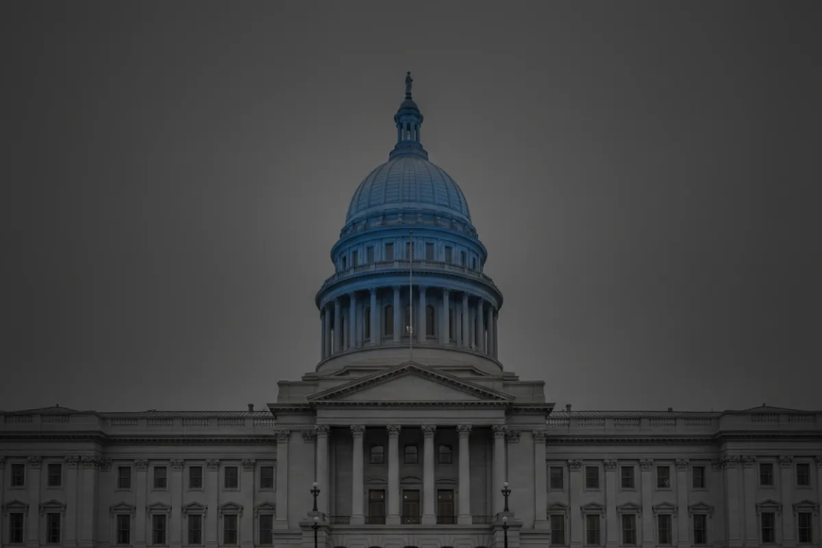 Desaturated architectural graphic of a state capitol building
