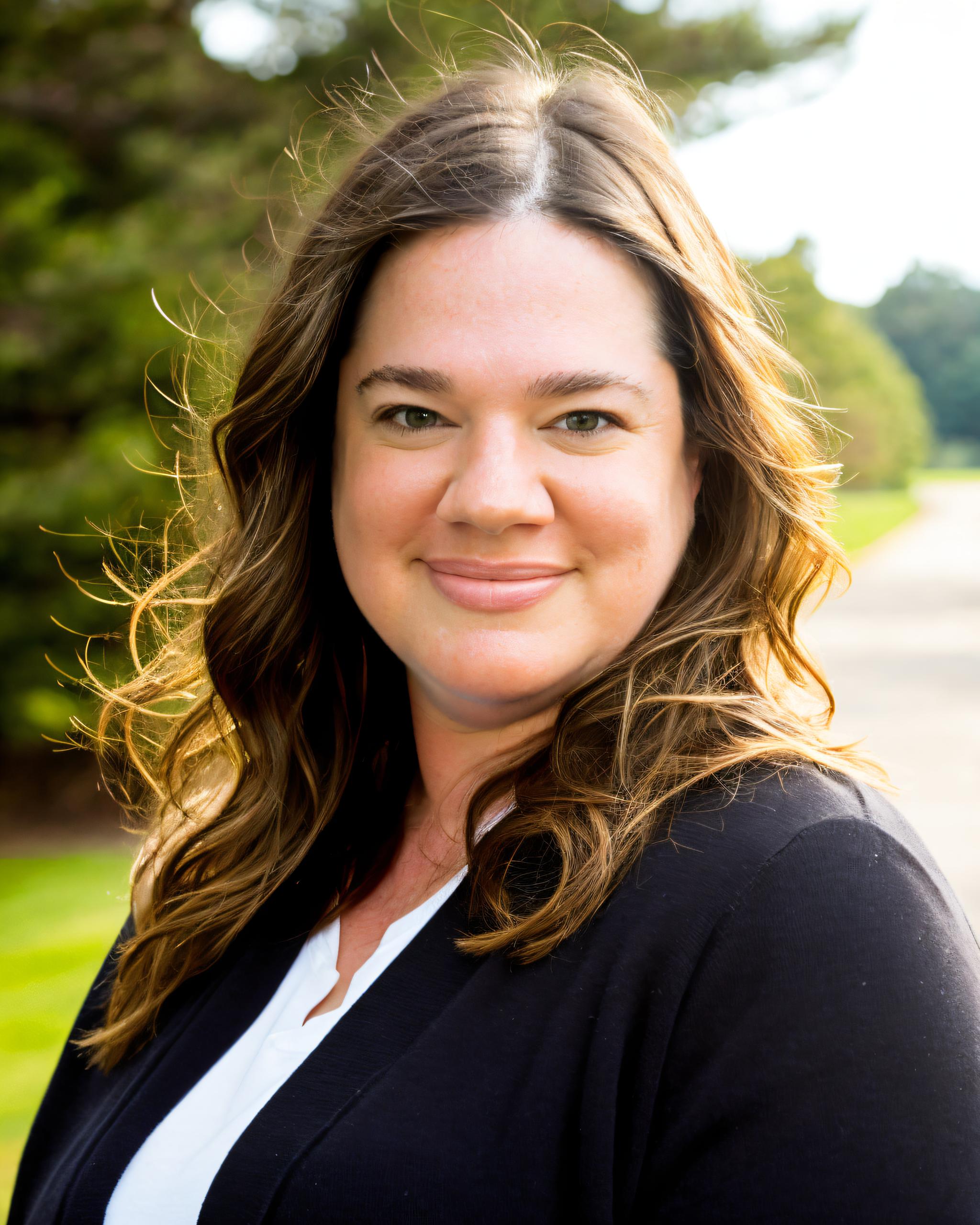 Danielle Young, Founder of Inspired Action Wellness, looking grounded and calm.
