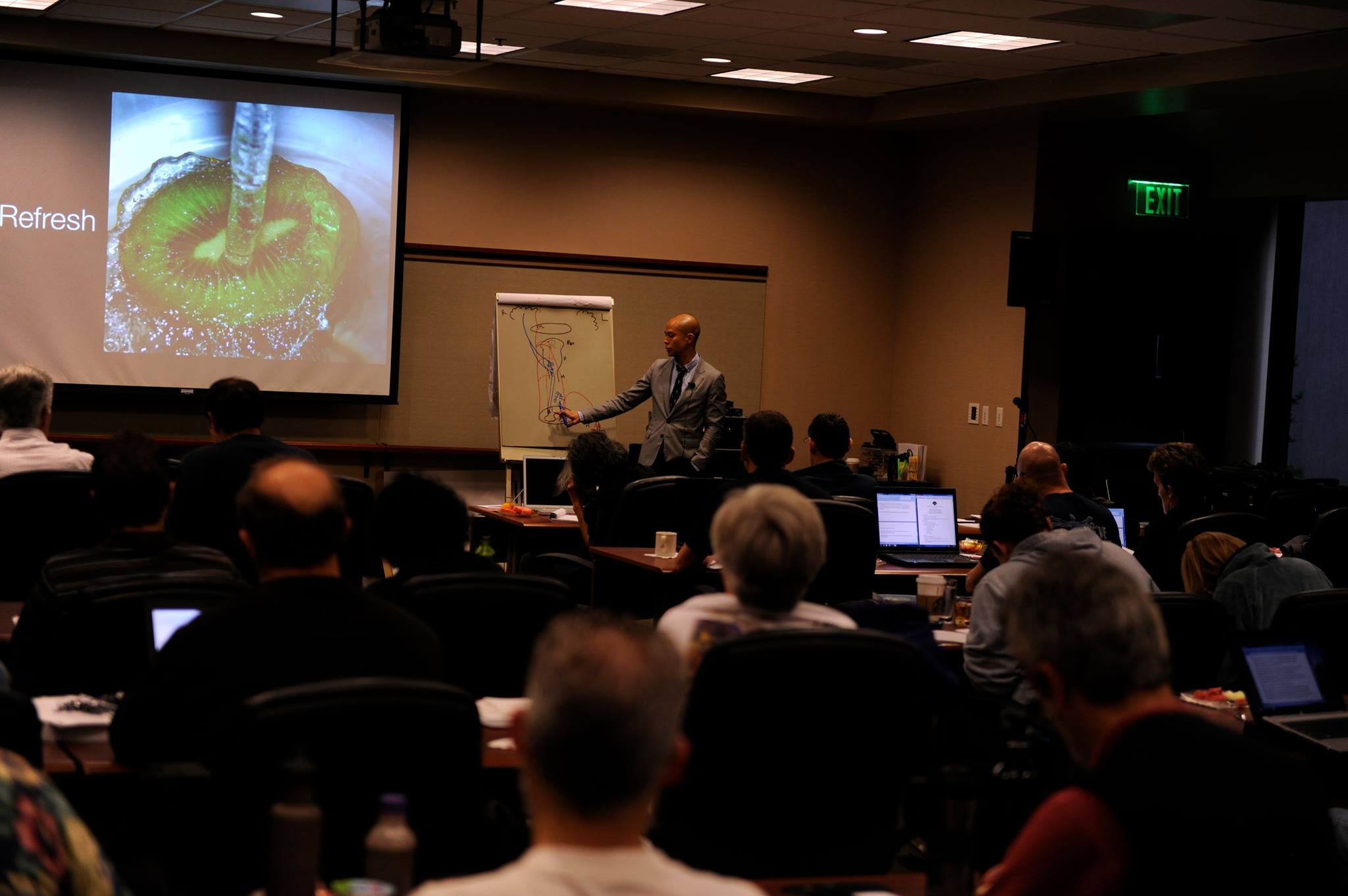 Dr. Titus Chiu presenting to an audience