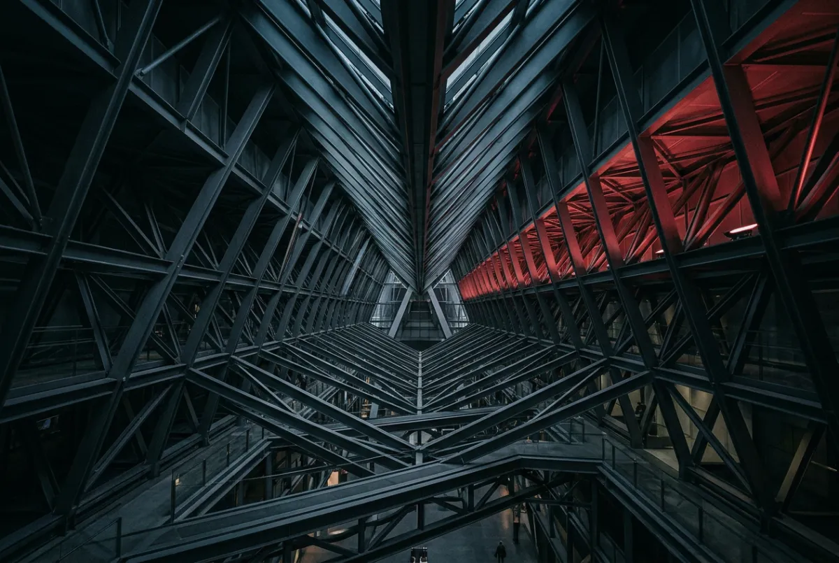 Sleek angular steel framework expanding outward representing scalable marketing and multi-channel growth