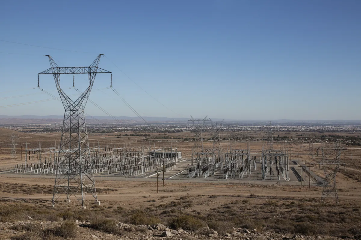 Panoramic view of high-voltage transmission lines feeding into substations and regional distribution networks.