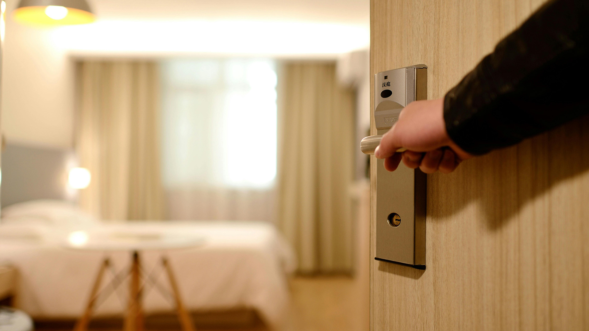 Person unlocking a door