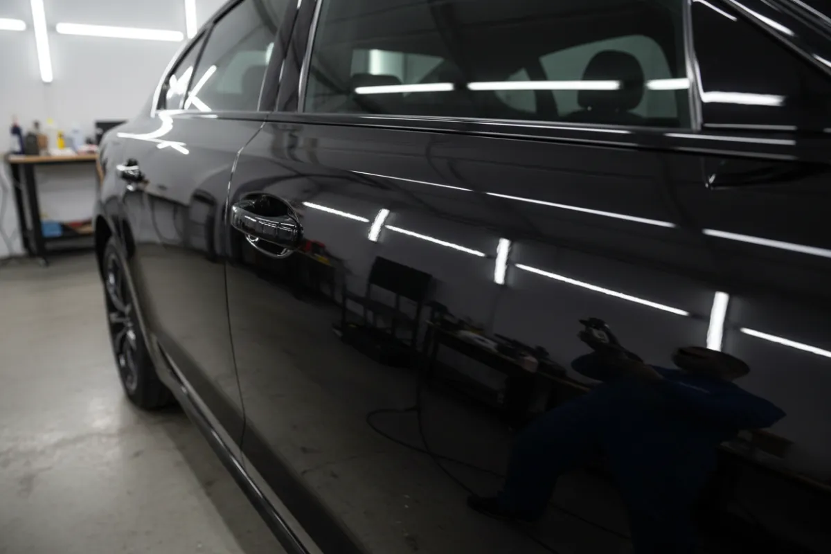 After shot of vehicle door with corrected, glossy paint and no swirl marks.