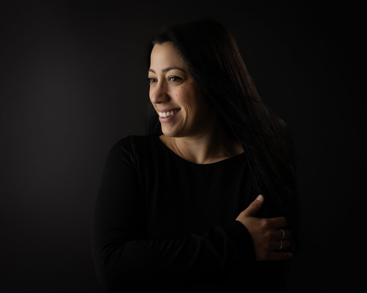 Woman sitting on bed