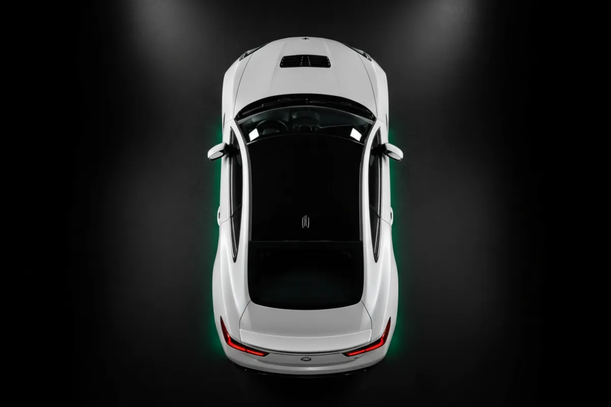 Sleek black roof wrap on a white sports car