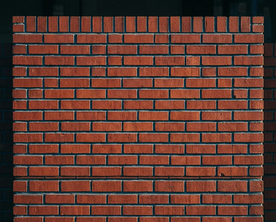 High-contrast structural brick masonry courses showing razor-sharp level and plumb string lines