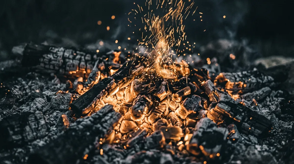 Wilderness apprentice holding vigil at night around an open fire in primeval forest