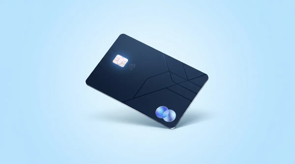 A dark blue credit card floating on a light blue background.