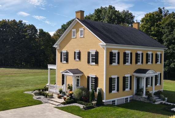 Suburban home with raised panel exterior shutters