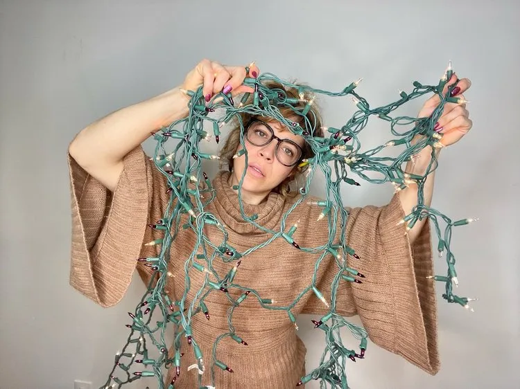 Woman with holiday lights