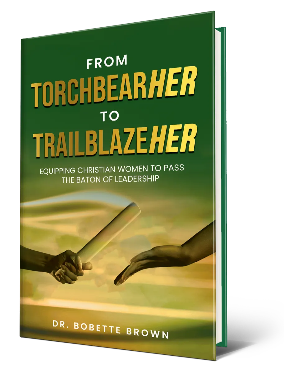 Book cover titled 'From Torchbearer to Trailblazer' by Dr. Bobette Brown, with a visual of a hand passing a baton to another hand, symbolizing leadership and leadership passing.
