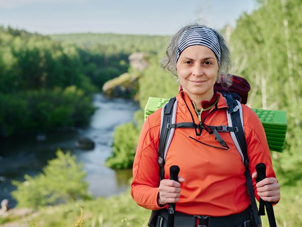 Woman hiking with poles