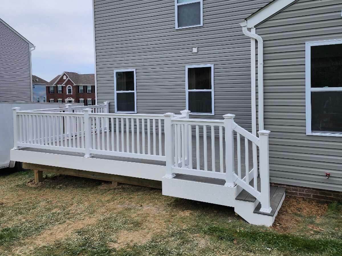 Wood deck with vinyl railings