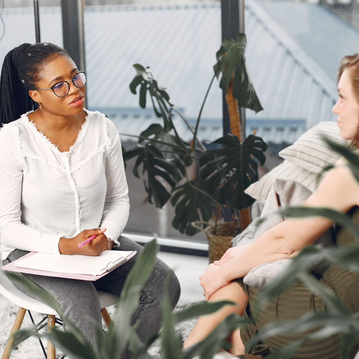 Stock image showing two people in conversation, reflecting the compassionate counseling experience offered by Grace & Gratitude Counseling in Downers Grove, IL