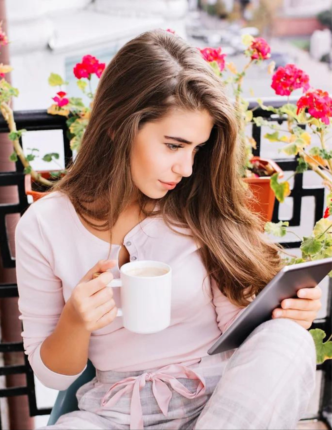 stock photo of woman reading outside with mug of coffee, relaxing. representing matching with a therapist that will work best for you
