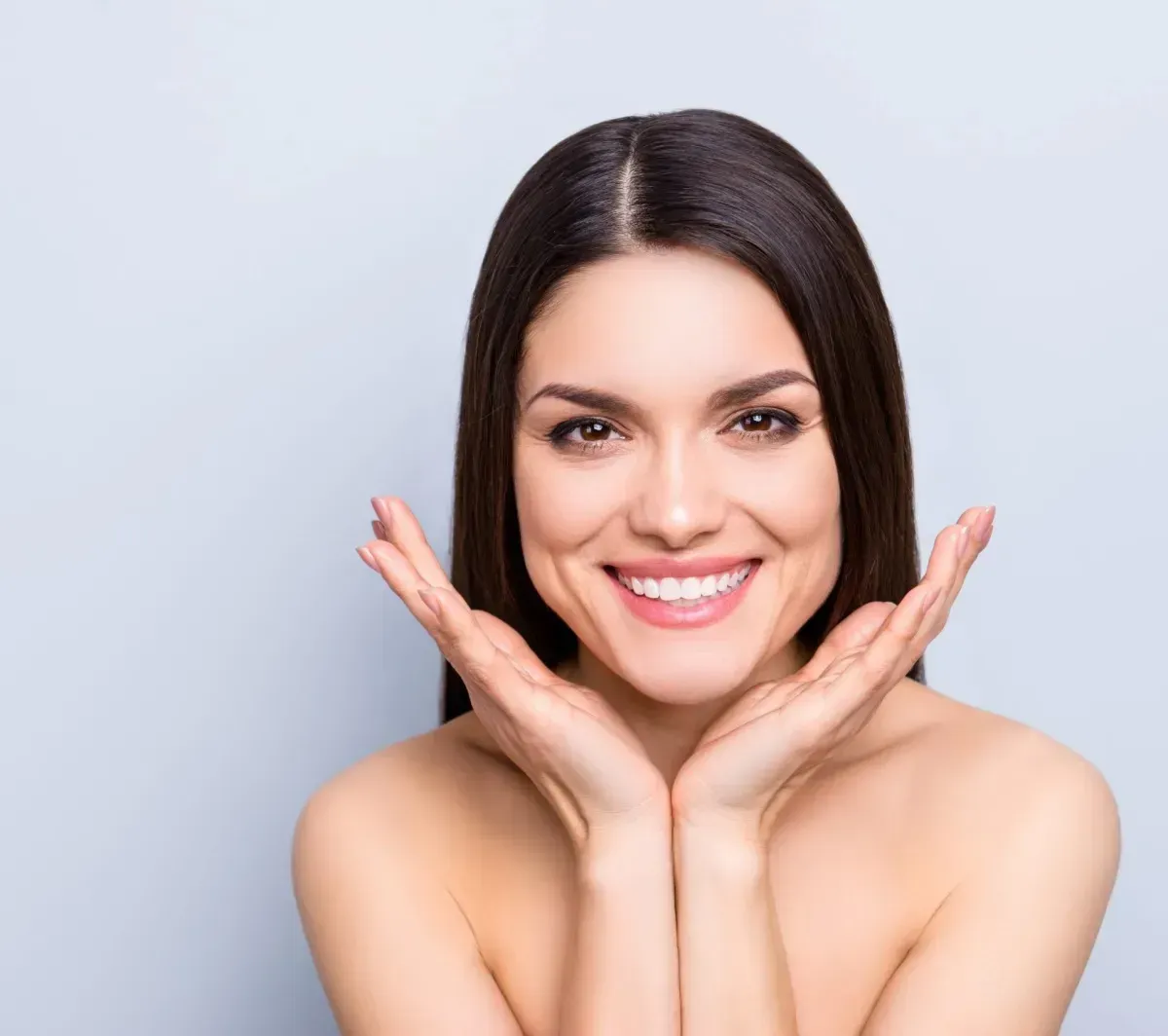 Smiling woman showcasing natural beauty results
