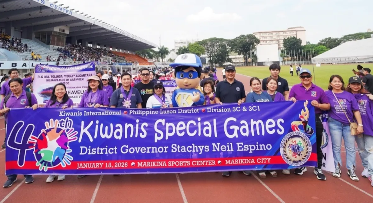 Volunteers and organizers holding the Kiwanis Special Games banner