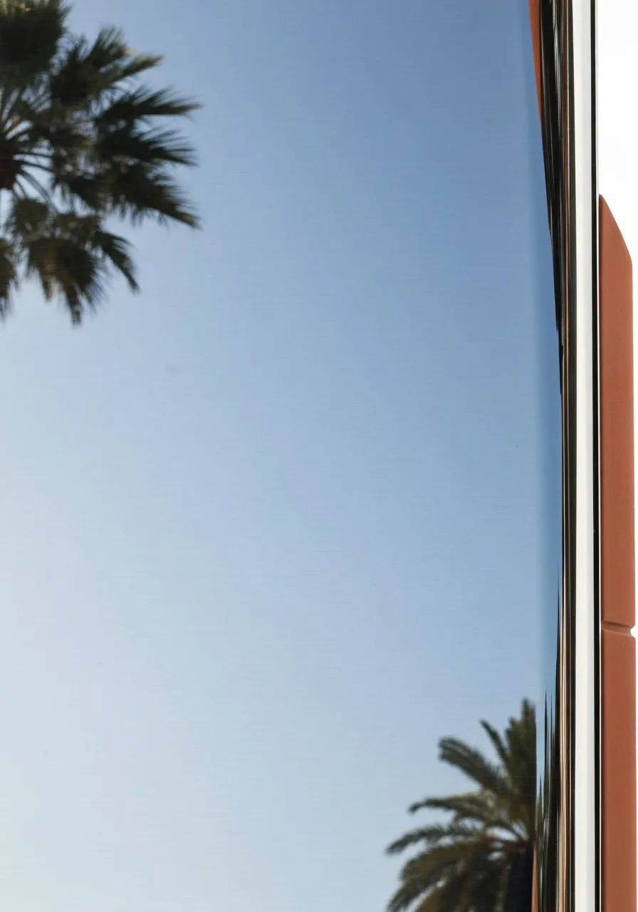 A static, close-up crop of a flawless mirror-polished stainless steel surface.
