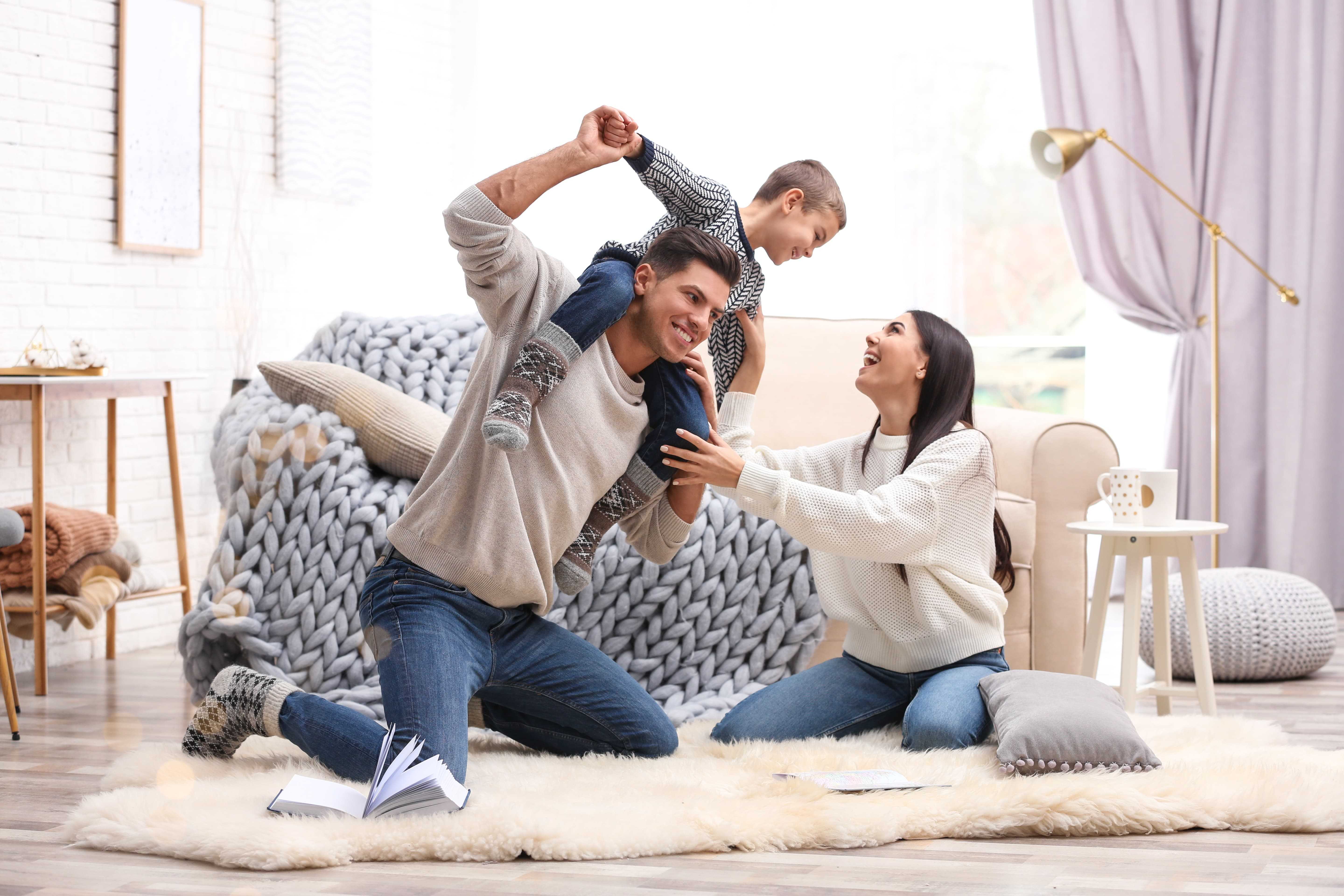 Family enjoying time together at home, representing home insurance coverage from We Insure Downtown Miami.