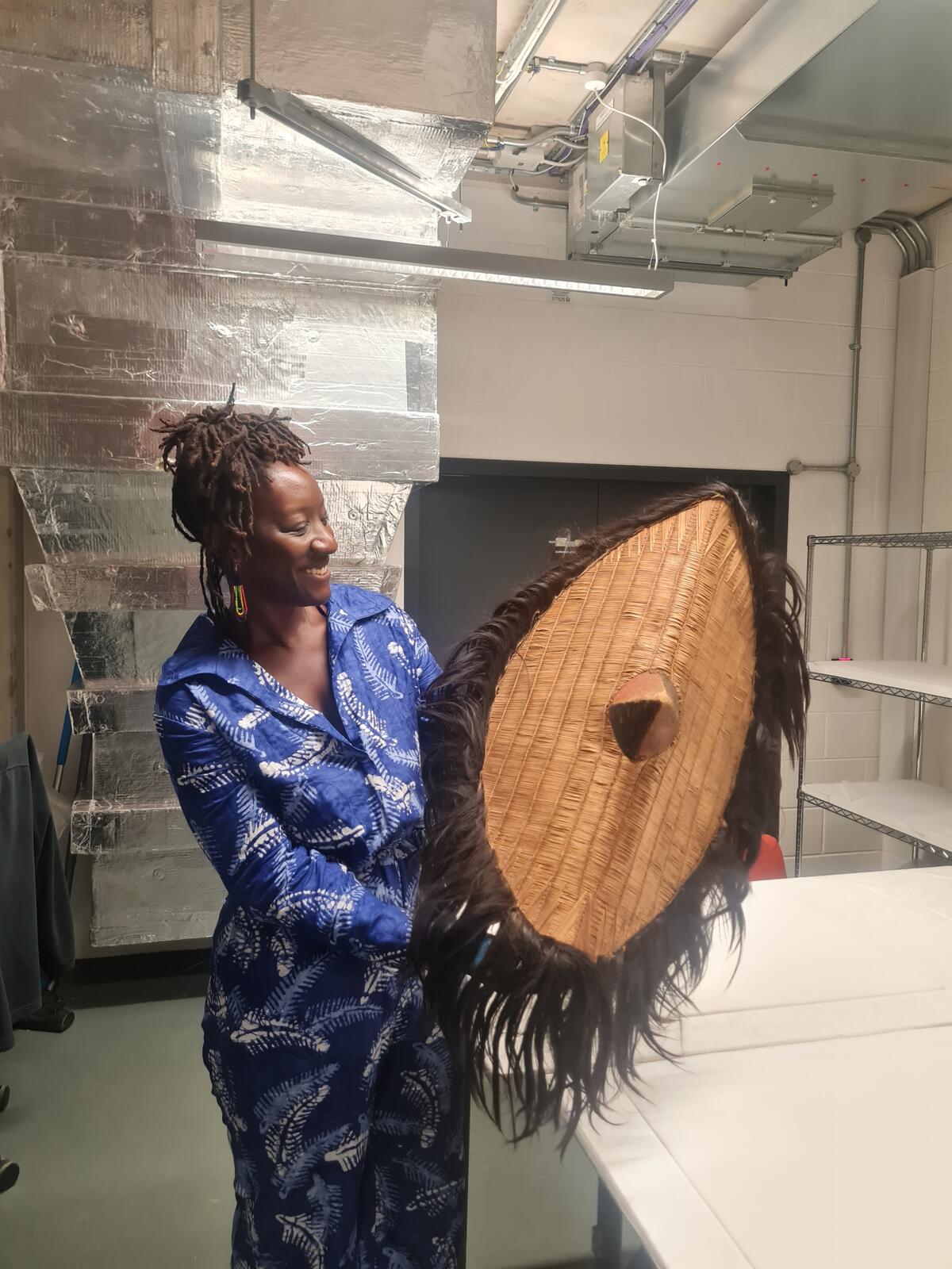 Birungi with traditional shield