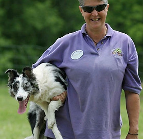 Owner holding dog
