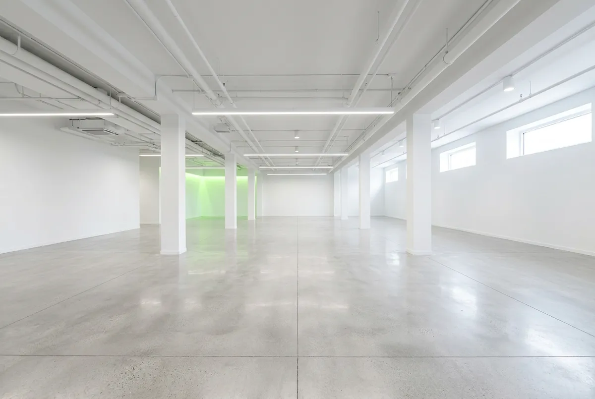 Immaculate empty concrete commercial basement thoroughly cleared, swept and ready for use