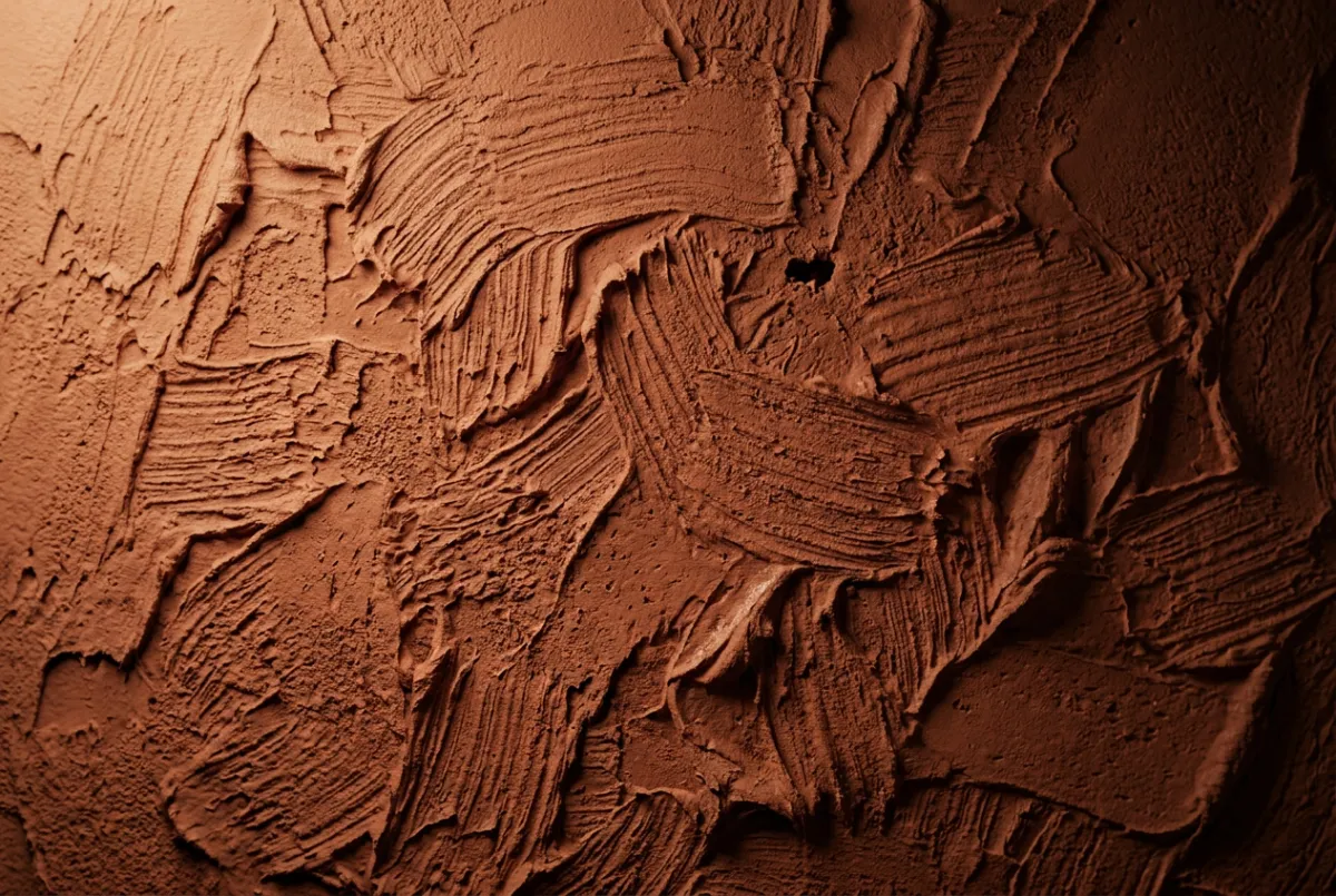 Tall 3D architectural digital art macro rendering of textured Venetian plaster and warm terracotta lime wash with tactile brush strokes
