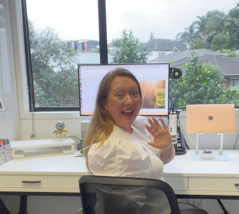 Tammy waving from desk
