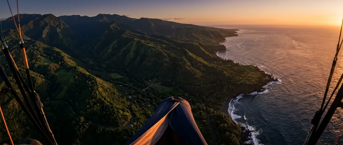 High-altitude tandem paragliding overlooking Haleakala crater and Maui coastline