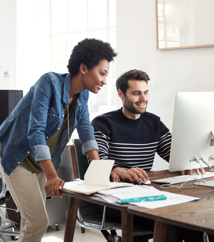 Two professionals looking at a computer screen