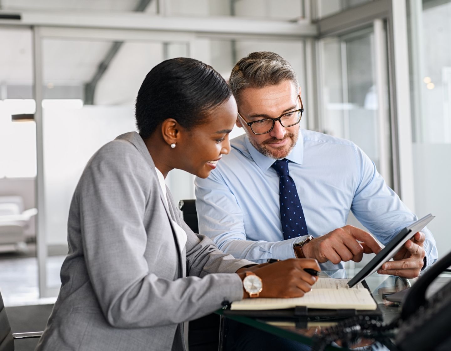 Colleagues looking at tablet