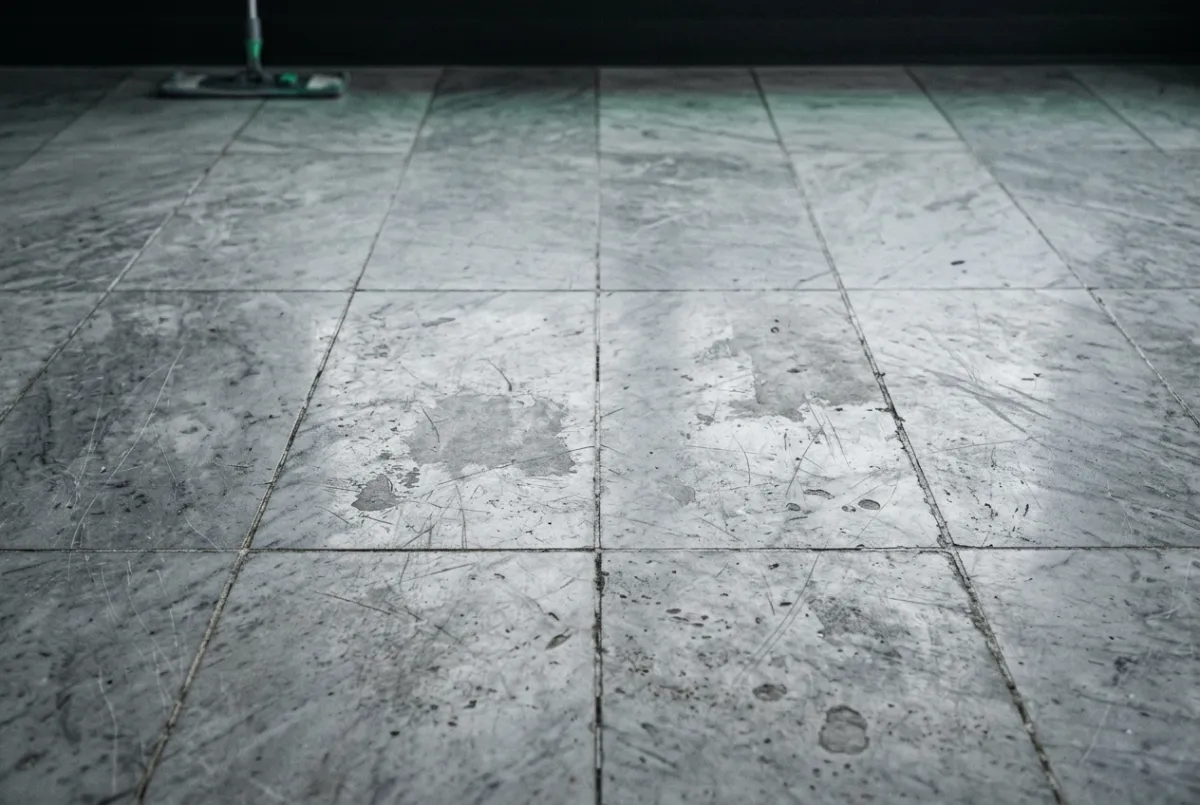 Dull, scratched, and etched marble floor before professional stone cleaning restoration